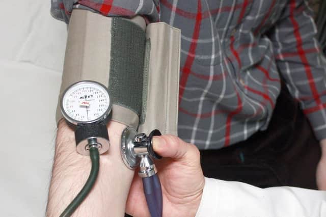 Blood pressure test being carried out by a health professional. (Picture: PA)