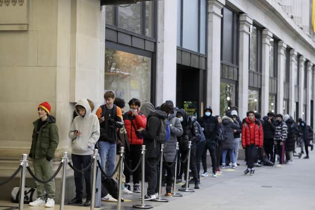 People queue to enter Selfridges department store on Oxford Street in London (AP Photo/Kirsty Wigglesworth)