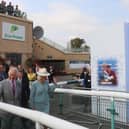 The King and Queen walks past the Betfred card to Frankie Dettori at Doncaster Racecourse (Picture: Betfred)