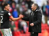 Lincoln City manager Michael Appleton congratulates Regan Poole after reaching the final of the League One play-offs.