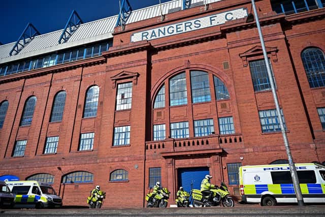 Police on duty outside Ibrox Stadium following the Old Firm derby in March 2021, a match that was at risk of cancellation after Rangers fans breached lockdown to celebrate their team's title win (Photo by Jeff J Mitchell/Getty Images)