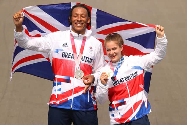 TOKYO, JAPAN - JULY 30: (L-R) Silver medalist Kye Whyte and gold medalist Bethany Shriever of Team Great Britain pose for a photograph while holding the flag of they country after the BMX final on day seven of the Tokyo 2020 Olympic Games at Ariake Urban Sports Park on July 30, 2021 in Tokyo, Japan. (Photo by Ezra Shaw/Getty Images)