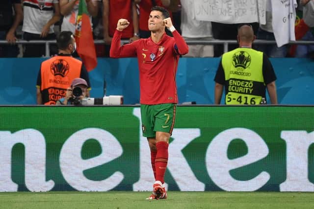 Portugal's forward Cristiano Ronaldo celebrates scoring the opening goal from the penalty spot during the UEFA EURO 2020 Group F football match between Portugal and France at Puskas Arena in Budapest on June 23, 2021. (Photo by FRANCK FIFE / POOL / AFP) (Photo by FRANCK FIFE/POOL/AFP via Getty Images)