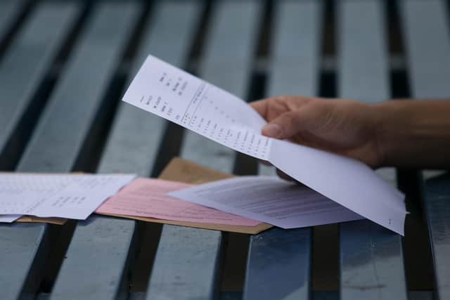 According to exams regulator Ofqual, this year’s national results will be lower than last year but are expected to be similar to those in 2019. (Photo by Matt Cardy/Getty Images)