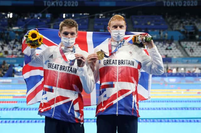 Silver medalist Duncan Scott of Team Great Britain and gold medalist Tom Dean of Team Great Britain pose with their medals for the Men's 200m Freestyle Final on day four of the Tokyo 2020 Olympic Games at Tokyo Aquatics Centre on July 27, 2021 in Tokyo, Japan. (Photo by Maddie Meyer/Getty Images)