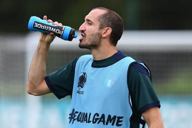 Giorgio Chiellini takes a drink during the training session ahead of the Euro 2020 Final match between Italy and England.
