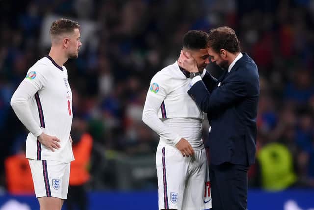LONDON, ENGLAND - JULY 11: Gareth Southgate consoles Jadon Sancho following defeat in the UEFA Euro 2020 Championship Final between Italy and England at Wembley Stadium on July 11, 2021 in London, England. (Photo by Laurence Griffiths/Getty Images)