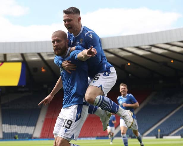 Shaun Rooney of St Johnstone celebrates after scoring with Isaac Olaofe  during the Scottish Cup Final between Hibernian and St Johnstone at Hampden Park.