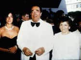 Robert Maxwell at a party on his yacht with daughter Ghislaine and wife Elisabeth, 1990. (Credit: Getty Images) 