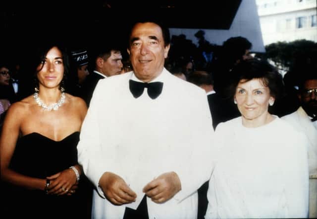Robert Maxwell at a party on his yacht with daughter Ghislaine and wife Elisabeth, 1990. (Credit: Getty Images) 