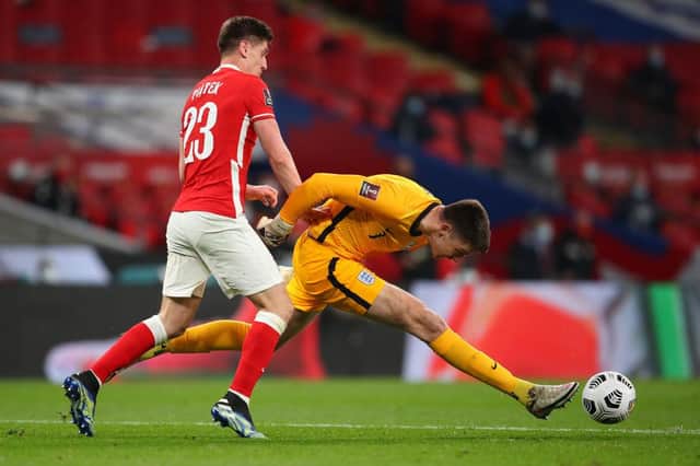 Nick Pope stretches to clear the ball away from Krzysztof Piatek of Poland. Pope didn't always look comfortable with the ball at his feet in the international games.