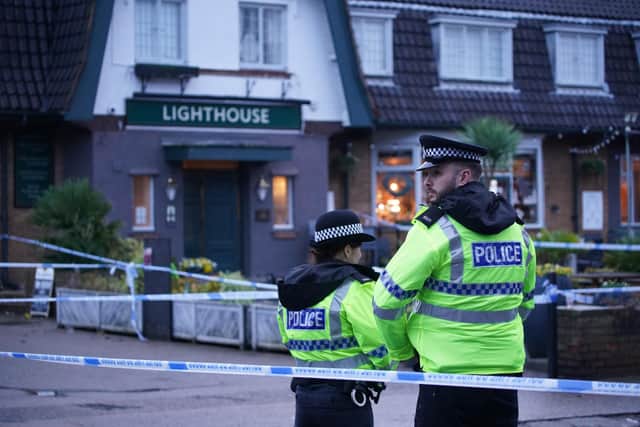 Police officers on duty at the Lighthouse Inn in Wallasey Village, near Liverpool, after a woman died and multiple people were injured in a shooting incident on Christmas Eve. Merseyside Police said officers were called to the pub on Saturday following reports of gunshots. A young woman was taken to hospital with an injury consistent with a gunshot wound and later died.