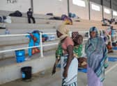 Displaced women from Palma are seen at the Pemba Sports center on April 2 where people were evacuated from the coasts of Palma after armed insurgents attacked the city on March 24. (Getty Images)