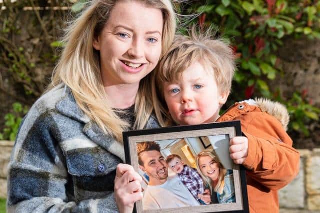 Danielle and Arlo with their favourite family photograph (Photo: Danielle Riley)