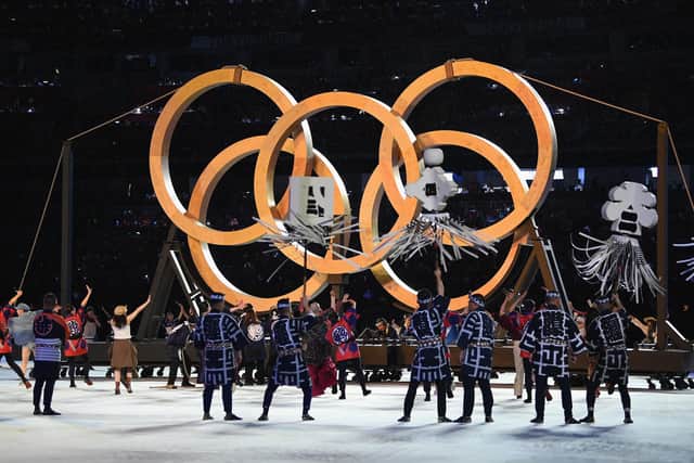 Perfomers are seen dancing infront of the Olympic Rings (Matthias Hangst/Getty)