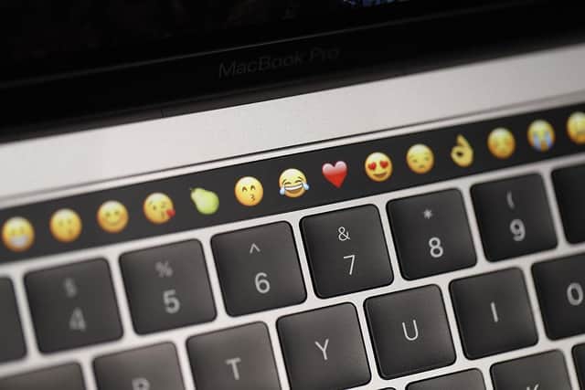 Classic emojis, including the crying laughing face, are declining in popularity according to a recent survey (Getty Images)
