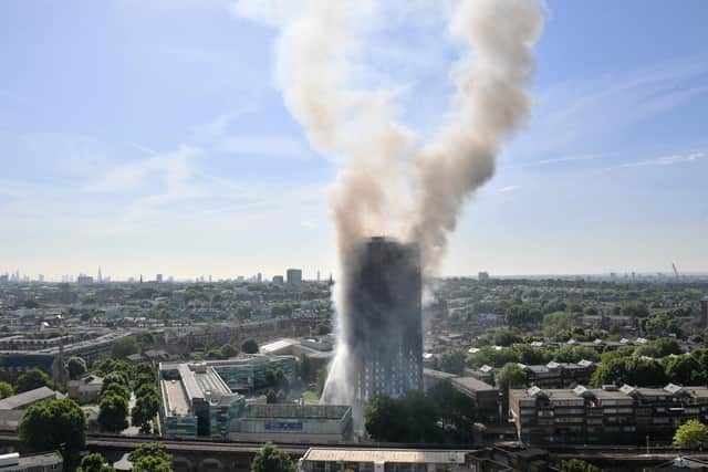 Smoke pictured billowing from the fire that engulfed the 23-storey Grenfell Tower in west London (PA)