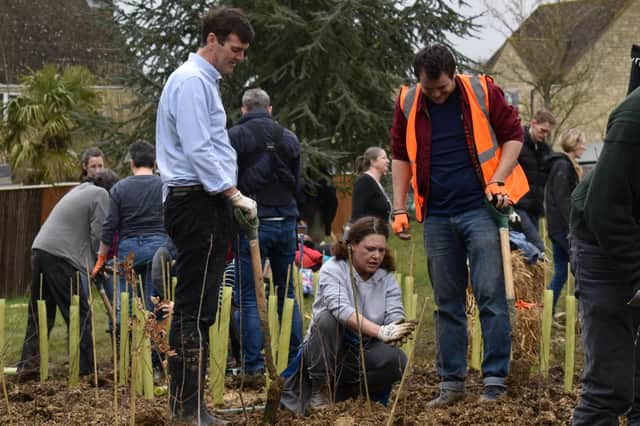Councillor Duncan Enright helping to plant trees on planting day, March 2020. Witney is home to the UK's first ever tiny forest.