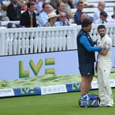 LONDON, ENGLAND - AUGUST 15: England bowler Mark Wood injures his shoulder after attempting to save a boundary during day four of the Second Test Match between England and India at Lord's Cricket Ground on August 15, 2021 in London, England. (Photo by Stu Forster/Getty Images)