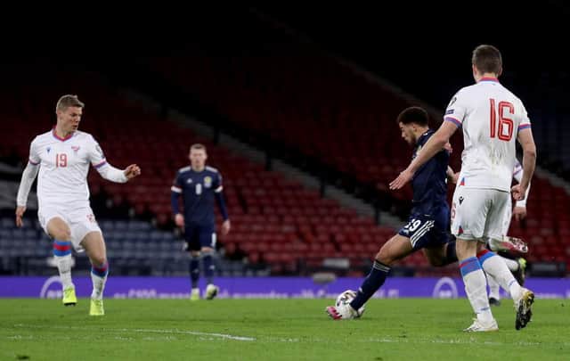 Che Adams rolls the ball home for his first goal for Scotland against Faroe Islands at Hampden Park.
