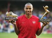 Thierry Henry of Arsenal shows off his Golden Boot and Barclaycard Premiership Player of the Year Award in 2004.
