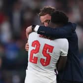Gareth Southgate comforts Bukayo Saka after his penalty was saved (Photo by LAURENCE GRIFFITHS/POOL/AFP via Getty Images)