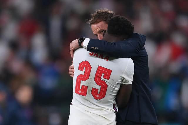 Gareth Southgate comforts Bukayo Saka after his penalty was saved (Photo by LAURENCE GRIFFITHS/POOL/AFP via Getty Images)