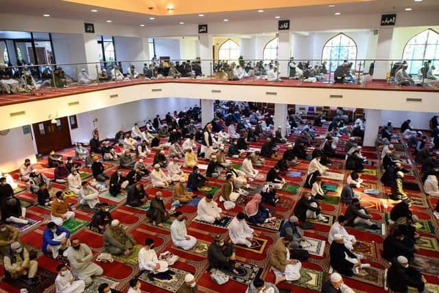 Muslims gather to perform the Eid Al-Fitr prayer. (Pic credit: Oli Scarff / AFP via Getty Images)