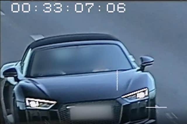 A 'smirking' stockbroker caught on camera hitting 141mph on a busy main road has been banned from driving.
James Linton, 24, 'showed a complete disregard for other motorists' when clocked driving a £90,000 Audi R8 soft-top at 'dangerous speeds' on the A27 in Sussex in April this year. Police said Linton was caught on camera "smirking" as he reached 141mph.
Picture: SWNS