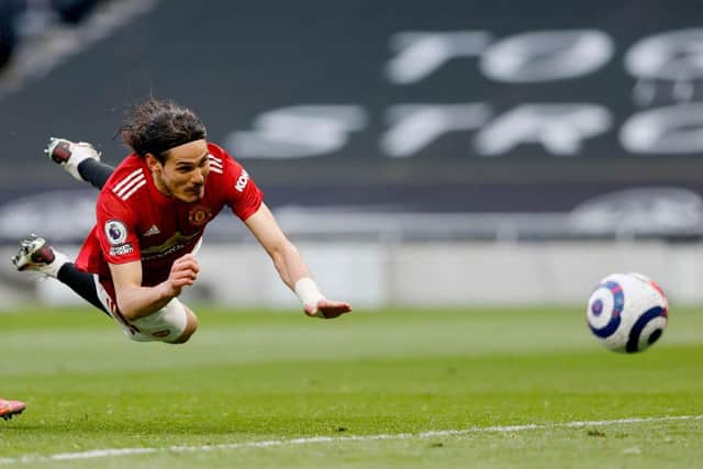 Edinson Cavani dives to head home from Greenwood's cross against Spurs.