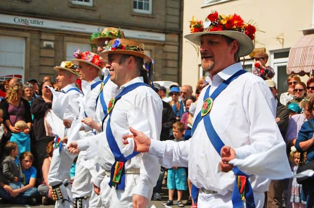 Morris dancers in the village square in Clun, Shropshire,  celebrating the May Day Bank Holiday.