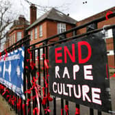 The fence outside James Allen's Girls' School (JAGS) in London, where pupils have pinned placards and red ribbons in protest against 'rape culture' and a nearby boys school which they have called a 'breeding ground for sexual predators' (Photo: Hollie Adams/Getty Images)