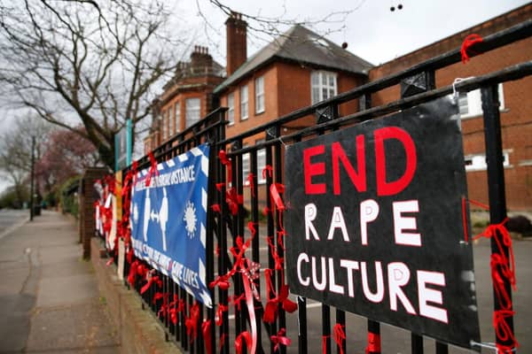 The fence outside James Allen's Girls' School (JAGS) in London, where pupils have pinned placards and red ribbons in protest against 'rape culture' and a nearby boys school which they have called a 'breeding ground for sexual predators' (Photo: Hollie Adams/Getty Images)