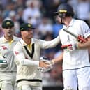 Australia's David Warner (C) shakes the hand of England's Zak Crawley (R) after he loses his wicket for 189 runs on day two of the fourth Ashes cricket Test match between England and Australia at Old Trafford cricket ground in Manchester, north-west England on July 20, 2023. (Photo by Oli SCARFF / AFP) / RESTRICTED TO EDITORIAL USE. NO ASSOCIATION WITH DIRECT COMPETITOR OF SPONSOR, PARTNER, OR SUPPLIER OF THE ECB (Photo by OLI SCARFF/AFP via Getty Images)