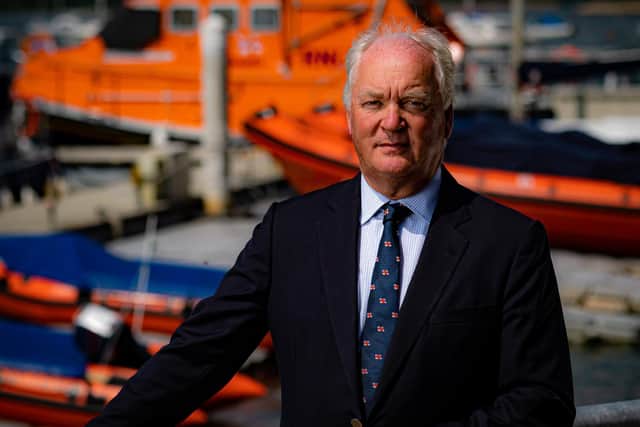 Royal National Lifeboat Institution (RNLI) chief executive Mark Dowie has defended lifeboat crews for helping rescue migrants at sea after volunteers reported being heckled for bringing people to safety (PA)
