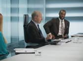 Lord Sugar talks to the candidates in the boardroom