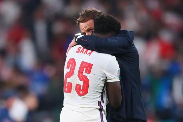 Bukayo Saka is consoled by Gareth Southgate. (Photo by Laurence Griffiths/Getty Images)