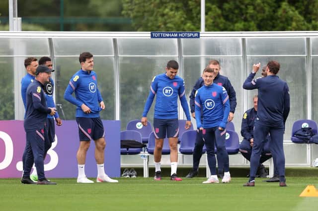 Gareth Southgate, Head Coach of England speaks with Harry Maguire, Conor Coady and Kieran Trippier. (Photo by Catherine Ivill/Getty Images)