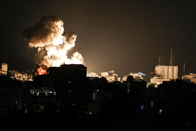Fire billows from Israeli air strikes in the Gaza Strip, controlled by the Palestinian Islamist movement Hamas, on May 13, 2021 (Photo by MAHMUD HAMS / AFP) (Photo by MAHMUD HAMS/AFP via Getty Images)