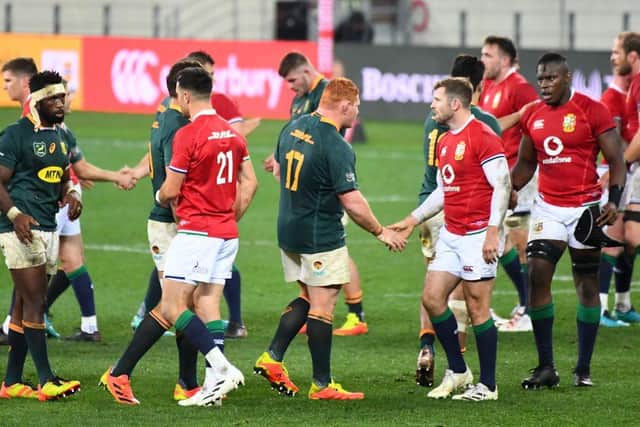 South Africa's and British and Irish Lions players shake hands after the first rugby union Test match at The Cape Town Stadium in Cape Town on July 24, 2021. (Photo by RODGER BOSCH / AFP) (Photo by RODGER BOSCH/AFP via Getty Images)