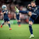 Scotland defender Liam Cooper kicks the ball during the FIFA World Cup Qatar 2022 qualification football match between Denmark and Scotland in Copenhagen on September 1, 2021