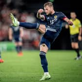 Scotland defender Liam Cooper kicks the ball during the FIFA World Cup Qatar 2022 qualification football match between Denmark and Scotland in Copenhagen on September 1, 2021