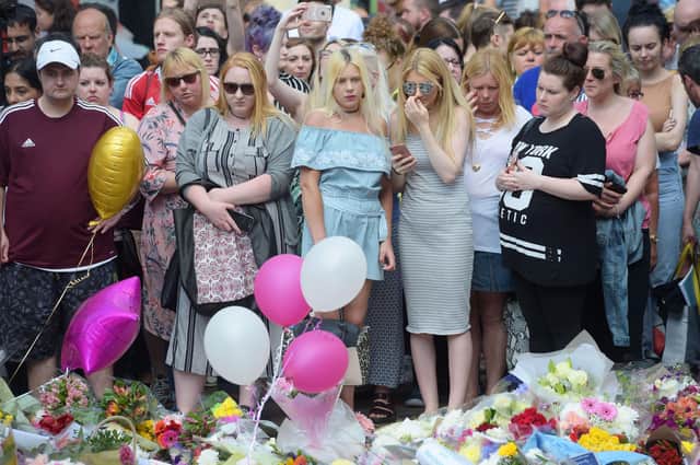 Floral tributes after a minute's silence in St Ann's Square, Manchester, to remember the victims of the terror attack in the city. A report examining security at Manchester Arena where 22 people were murdered and hundreds were injured in a suicide bombing at the end of an Ariana Grande concert in May 2017 was published today. (Photo: Ben Birchall, PA)