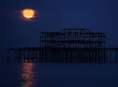 A supermoon rising over the West Pier on May 07, 2020 in Brighton.
