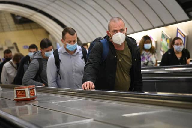 Commuters wear face masks as they pass through Vauxhall underground station in June 2020 - nearly a full year on, face coverings remain mandatory (Photo: Leon Neal/Getty Images)