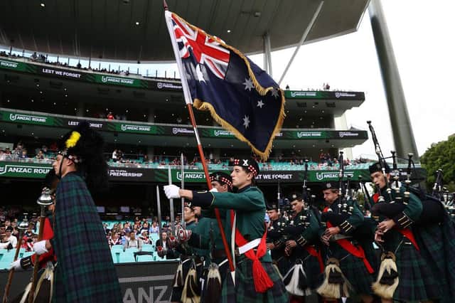 The Scots College Pipe band performs during an ANZAC Day ceremony ahead of the round seven NRL match between the Sydney Roosters and the St George Illawarra Dragons at the Sydney Cricket Ground, on April 25, 2021, in Sydney, Australia.