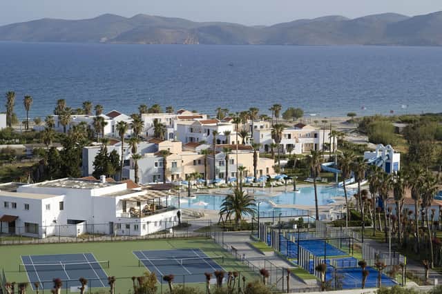 A bird's eye view of the main pool area and the tennis and paddle courts