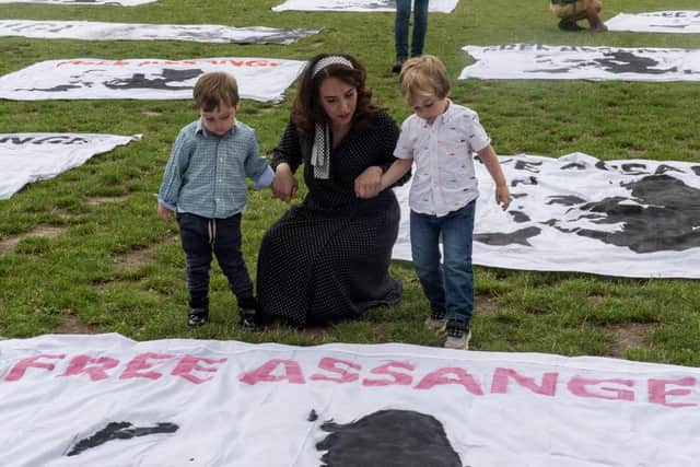 Assange's wife and two sons attended a protest in Parliament Square, which took place on the Whistle blower's 50th birthday (Picture: Getty Images)