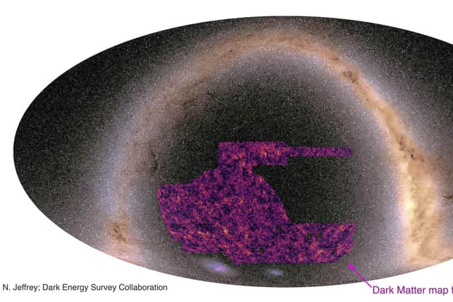 The map superimposed on an image of the Milky Way showing areas of dark matter - light areas show regions where dark matter is most dense and correspond to superclusters of galaxies, while the almost black patches are large empty spaces in between the clusters (Image: N. Jeffrey/Dark Energy Survey collaboration/PA Media)