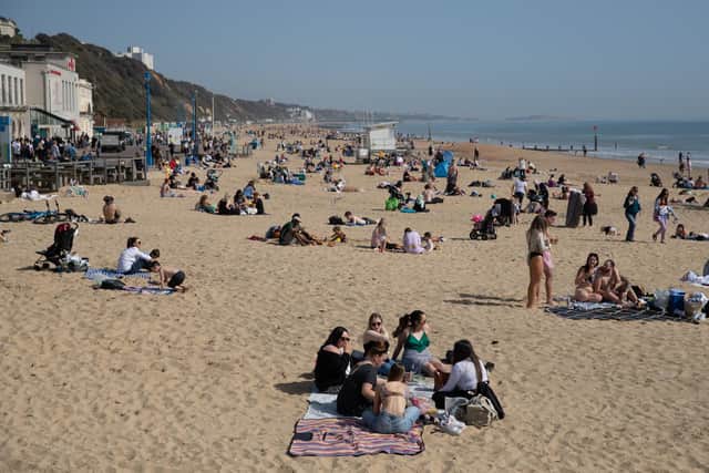People enjoy the warm weather on Bournemouth beach in Dorset, as the UK has recorded its warmest March day in 53 years (Photo: Andrew Matthews/PA Wire/PA Images)